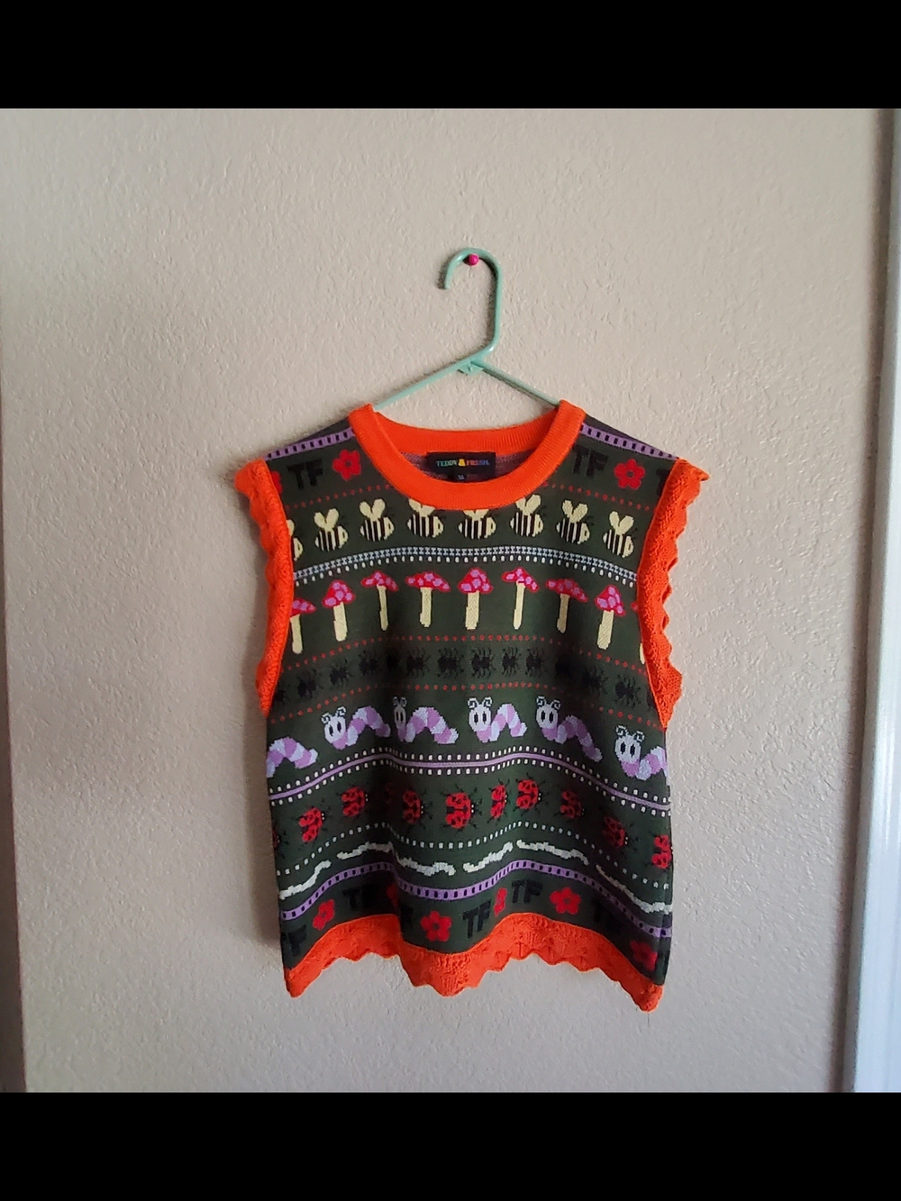 Teddy Fresh Green Knit Vest with Orange Trim and Whimsical Motifs